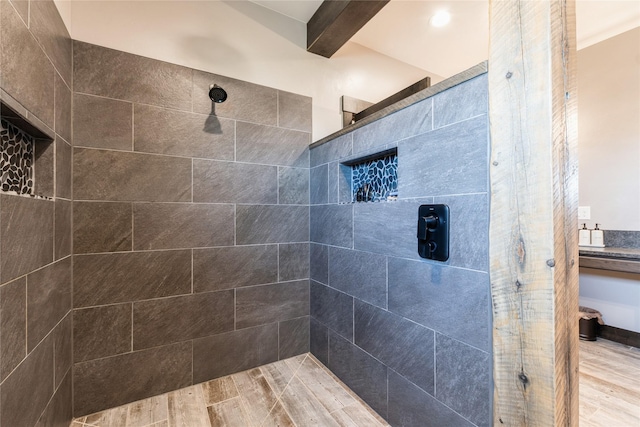 124 Hidden Waters Ln, Kalispell, MT 59901 - bathroom featuring tiled shower and wood finished floors