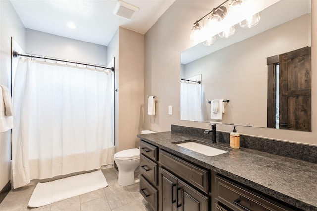 124 Hidden Waters Ln, Kalispell, MT 59901 - full bathroom with vanity, toilet, shower / bath combo, and tile patterned flooring