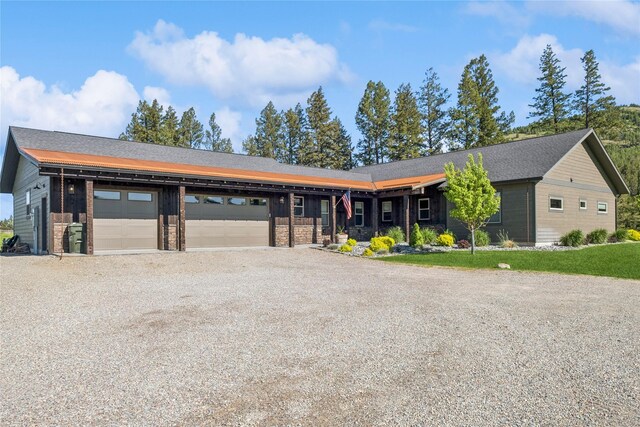 124 Hidden Waters Ln, Kalispell, MT 59901 - view of front of house with an attached garage and driveway