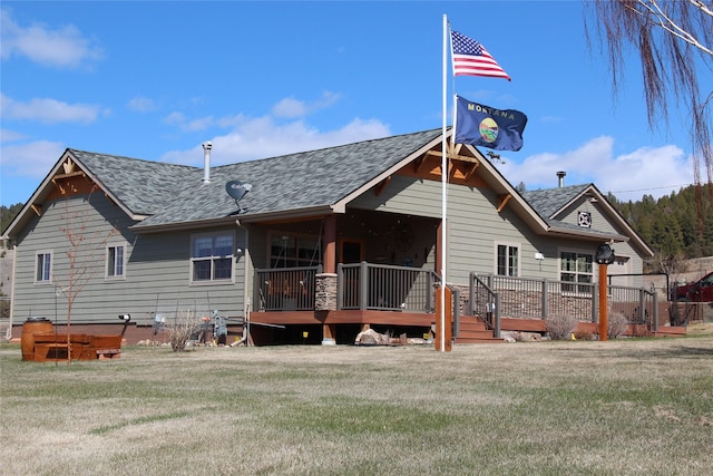 415 Galena Rd, Philipsburg, MT 59858 - back of property with a shingled roof, a deck, and a lawn