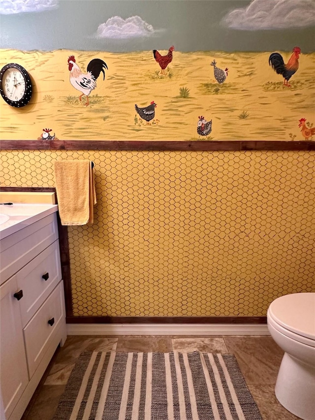 415 Galena Rd, Philipsburg, MT 59858 - bathroom with toilet, vanity, and a wainscoted wall