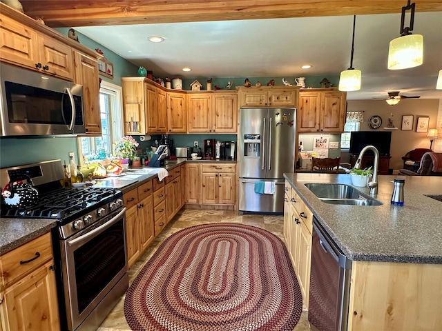 415 Galena Rd, Philipsburg, MT 59858 - kitchen with recessed lighting, an island with sink, stainless steel appliances, a sink, and hanging light fixtures
