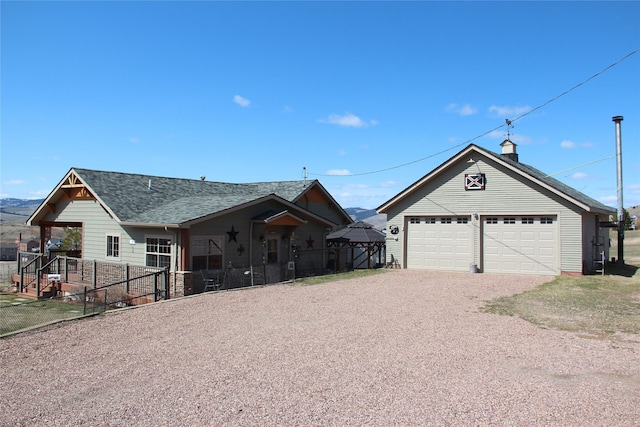 415 Galena Rd, Philipsburg, MT 59858 - ranch-style house featuring a shingled roof, a garage, fence, and an outbuilding