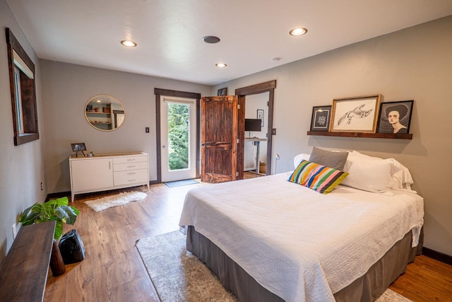 bedroom with recessed lighting, access to outside, baseboards, and wood finished floors
