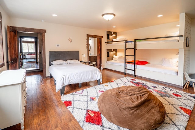 bedroom with wood finished floors and recessed lighting