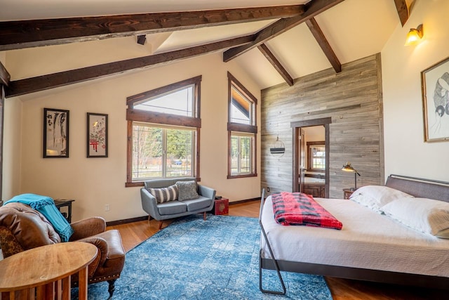 bedroom with high vaulted ceiling, wood finished floors, wood walls, baseboards, and beam ceiling