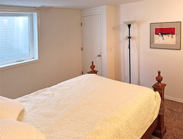 carpeted bedroom with baseboards and visible vents