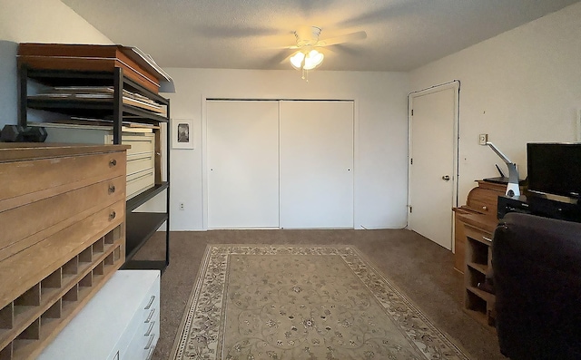carpeted bedroom with a closet and a ceiling fan