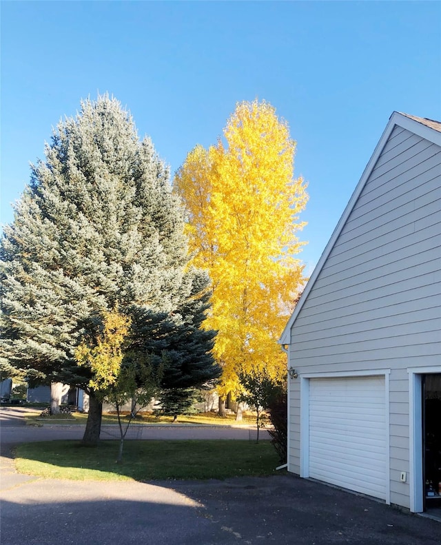 view of side of property featuring a garage