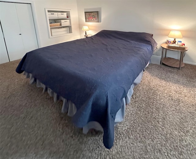 carpeted bedroom with a closet