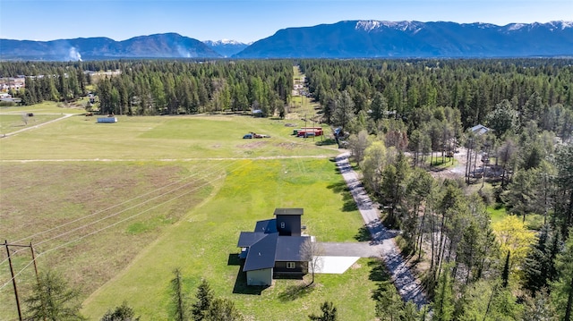 15 Sandy Hill Ter, Columbia Falls, MT 59912 - view of front facade with an attached garage, asphalt driveway, metal roof, and a porch