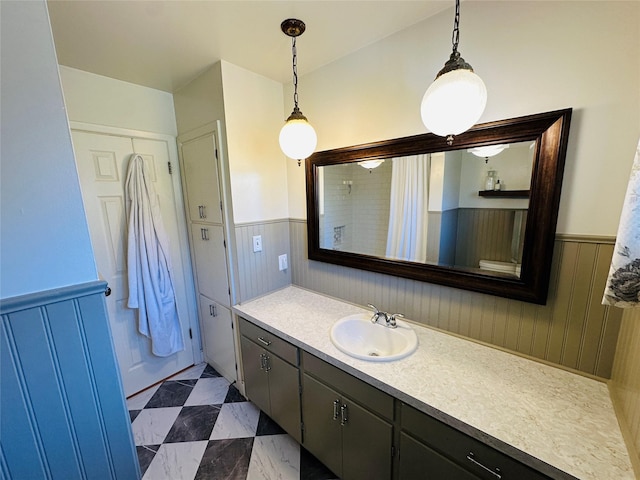 767 33rd Ave NE, Great Falls, MT 59404 - bathroom with vanity, a wainscoted wall, and a shower with shower curtain