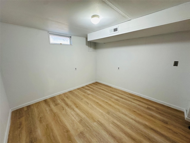 767 33rd Ave NE, Great Falls, MT 59404 - below grade area featuring light wood-style flooring and baseboards