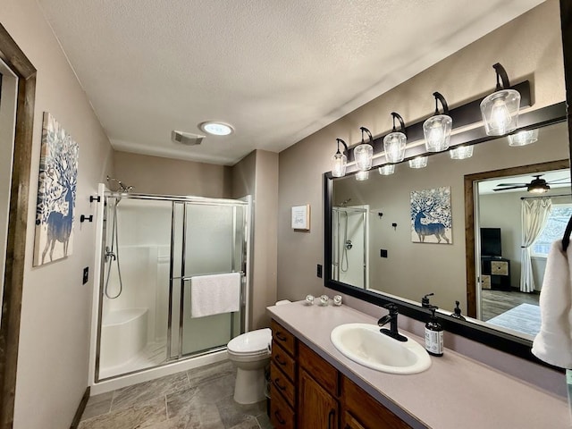 992 Trumble Creek Rd, Kalispell, MT 59901 - full bath with a stall shower, a textured ceiling, and vanity