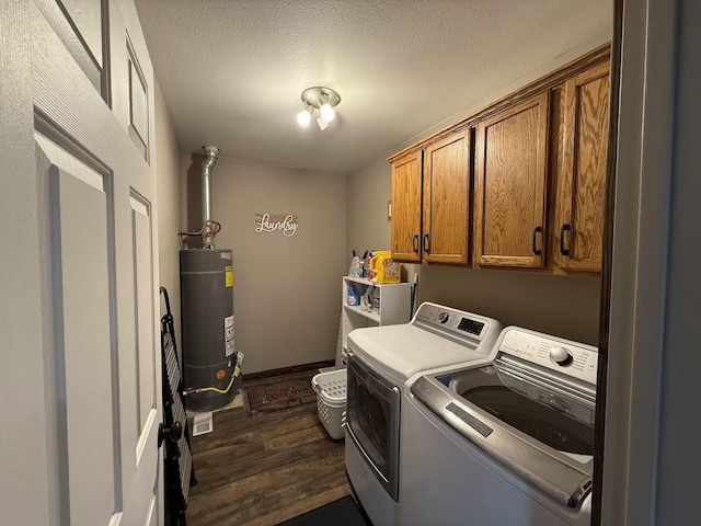 992 Trumble Creek Rd, Kalispell, MT 59901 - laundry room with water heater, cabinet space, washer and clothes dryer, dark wood finished floors, and a textured ceiling