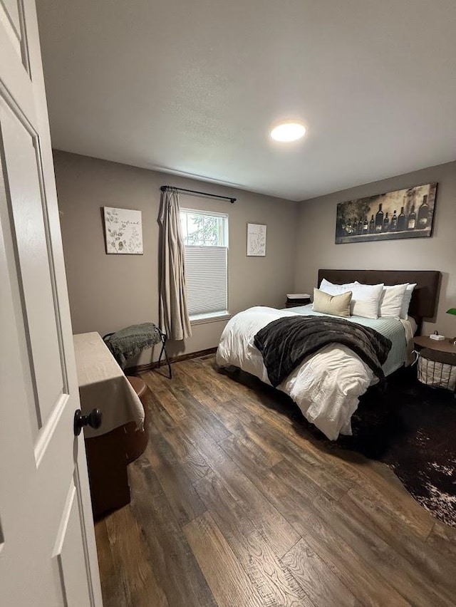 992 Trumble Creek Rd, Kalispell, MT 59901 - bedroom with dark wood-style flooring