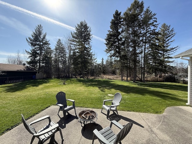 992 Trumble Creek Rd, Kalispell, MT 59901 - view of patio / terrace with an outdoor fire pit