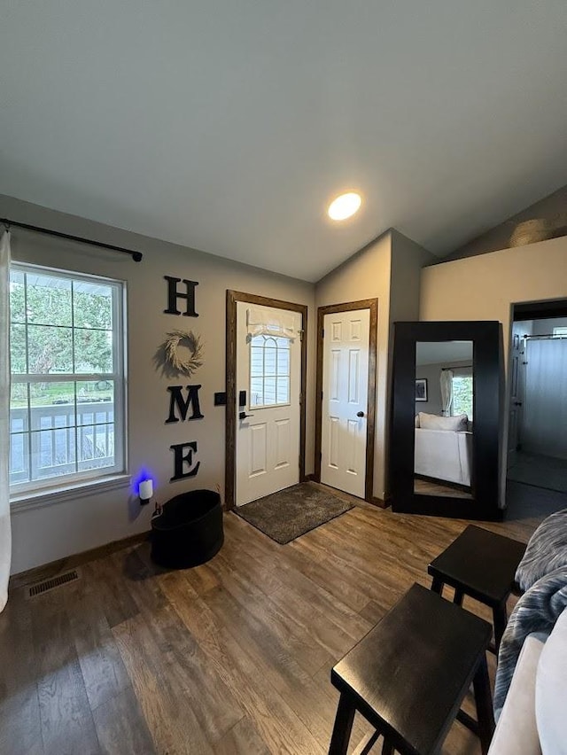 992 Trumble Creek Rd, Kalispell, MT 59901 - foyer entrance with vaulted ceiling, plenty of natural light, and wood finished floors