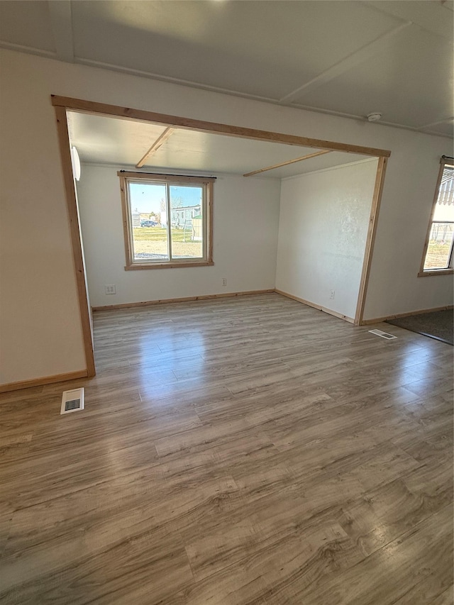 3805 7th St NE Unit 26, Great Falls, MT 59404 - unfurnished room featuring visible vents, baseboards, and wood finished floors