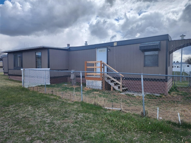 3805 7th St NE Unit 26, Great Falls, MT 59404 - rear view of house with fence