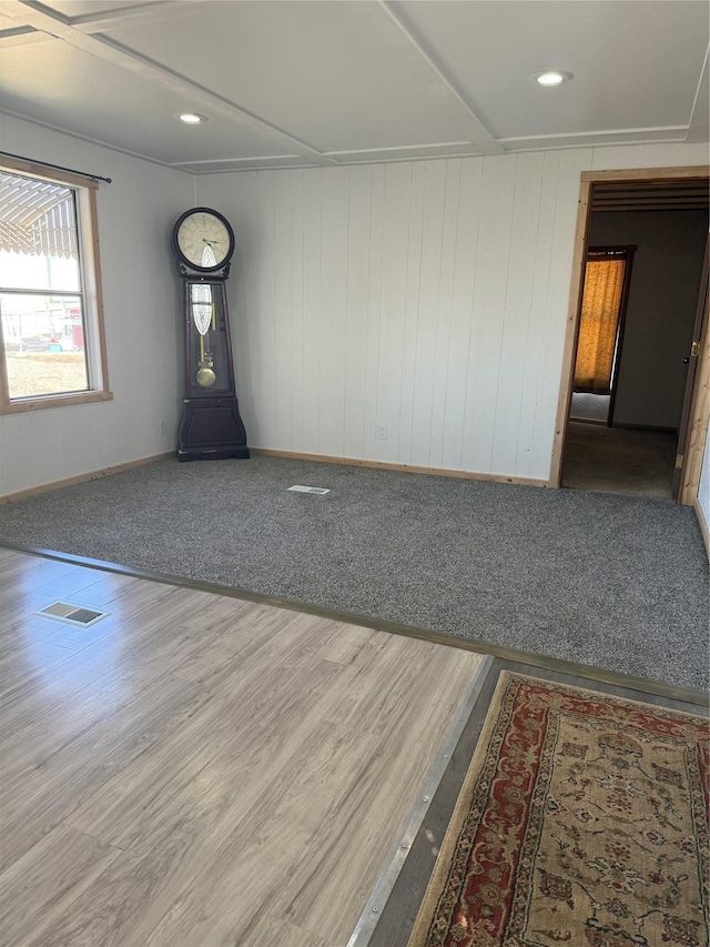 3805 7th St NE Unit 26, Great Falls, MT 59404 - unfurnished living room with visible vents, baseboards, and wood finished floors