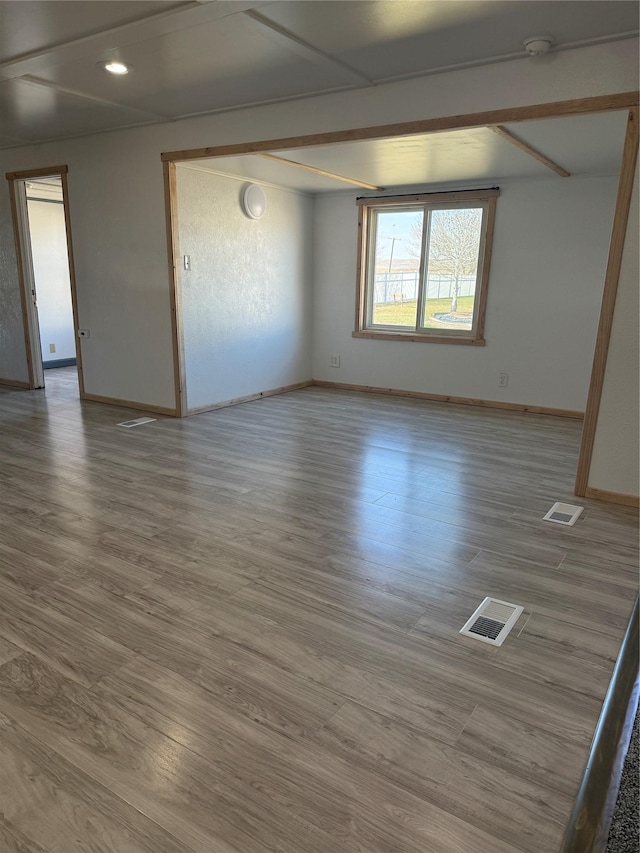 3805 7th St NE Unit 26, Great Falls, MT 59404 - spare room featuring visible vents, baseboards, and wood finished floors