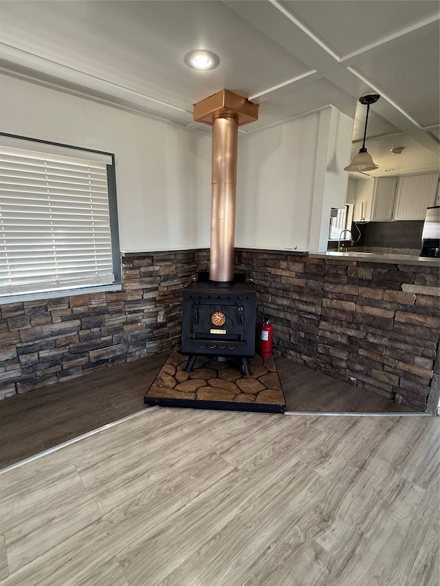 3805 7th St NE Unit 26, Great Falls, MT 59404 - details with wainscoting, wood finished floors, recessed lighting, and a wood stove
