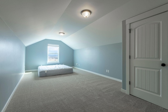 2240 Kenai Rd, Helena, MT 59602 - unfurnished bedroom featuring carpet floors, baseboards, and vaulted ceiling