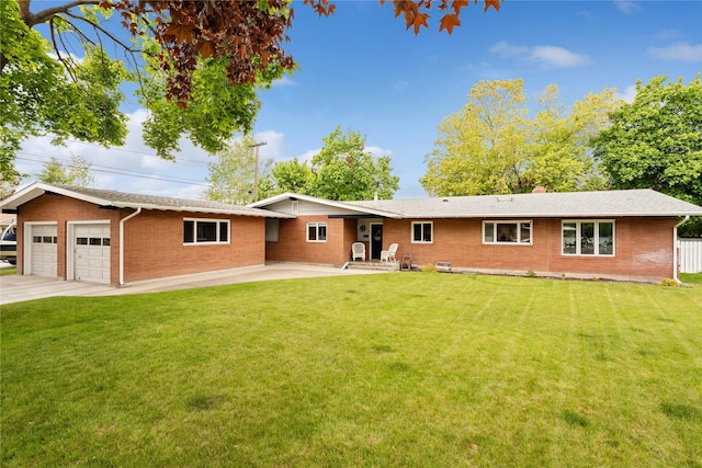 2324 Cloverdale Dr, Missoula, MT 59803 - single story home with brick siding, an attached garage, a patio, and driveway