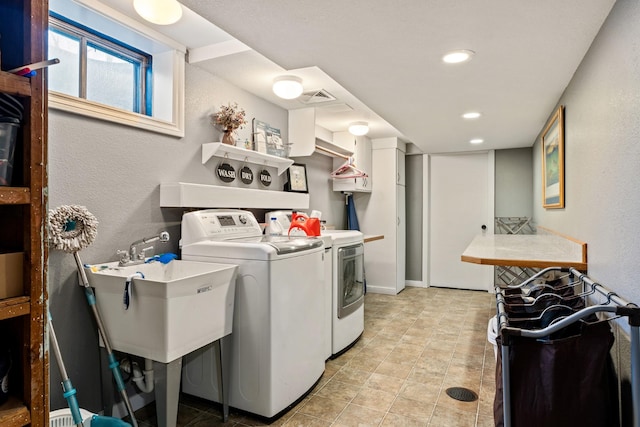 2324 Cloverdale Dr, Missoula, MT 59803 - laundry room with washing machine and dryer, recessed lighting, and a textured wall