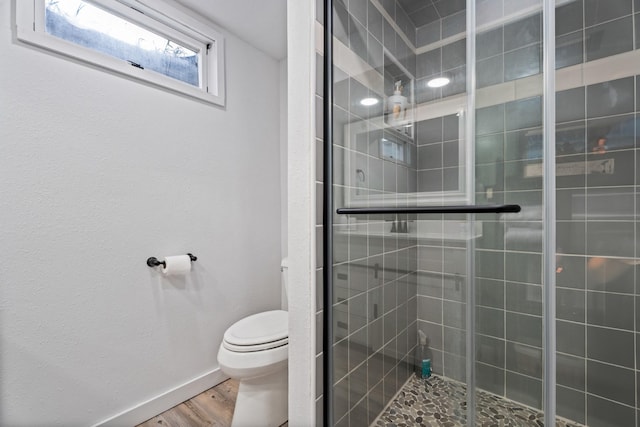 2324 Cloverdale Dr, Missoula, MT 59803 - full bath featuring toilet, wood finished floors, a stall shower, and baseboards