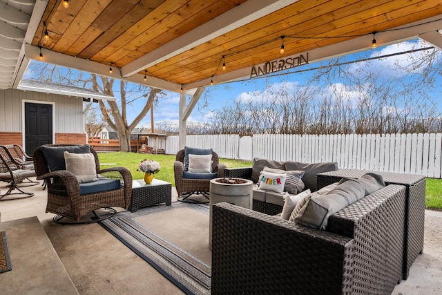 2324 Cloverdale Dr, Missoula, MT 59803 - fenced backyard featuring an outdoor living space with a fire pit and a patio