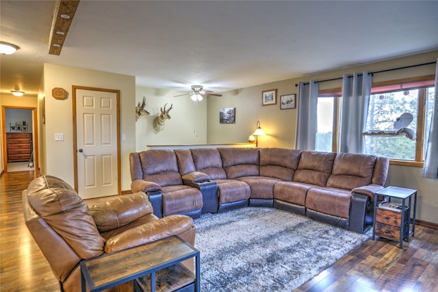 living room featuring a ceiling fan and wood finished floors