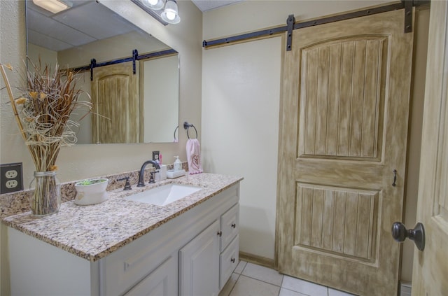 bathroom featuring tile patterned floors and vanity