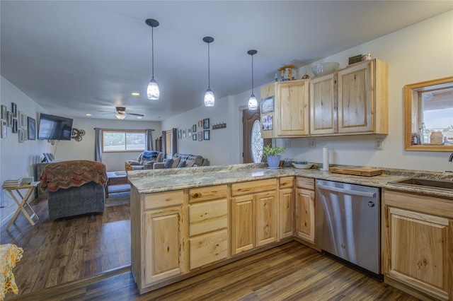 kitchen with dishwasher, a sink, open floor plan, light brown cabinetry, and a peninsula