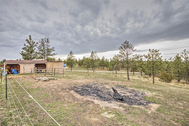 view of yard with an outbuilding and an outdoor structure