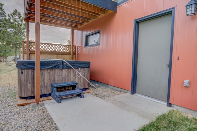 exterior space with a hot tub