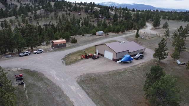 birds eye view of property featuring a mountain view