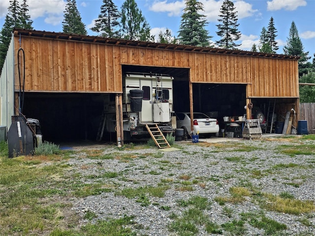 64 Ponderosa Ln, Thompson Falls, MT 59873 - view of pole building featuring a carport