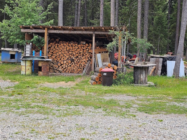 64 Ponderosa Ln, Thompson Falls, MT 59873 - view of yard featuring an outbuilding and a forest view
