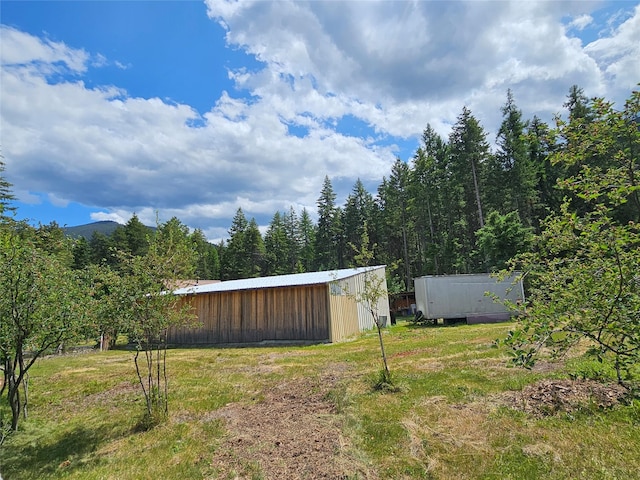 64 Ponderosa Ln, Thompson Falls, MT 59873 - view of yard featuring a pole building and an outbuilding