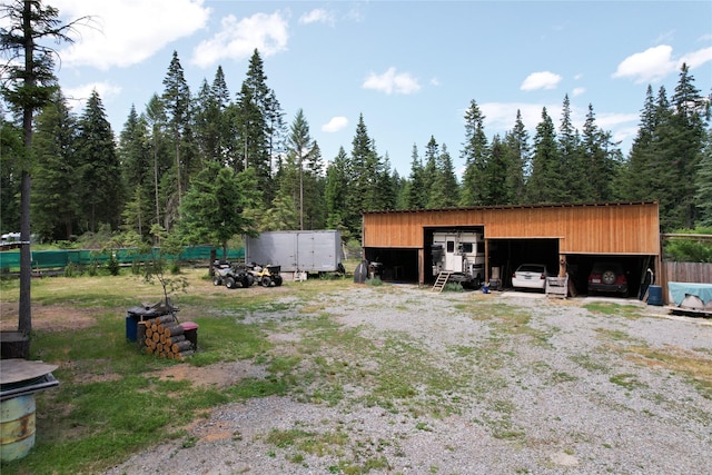 64 Ponderosa Ln, Thompson Falls, MT 59873 - view of yard featuring an outbuilding and a pole building