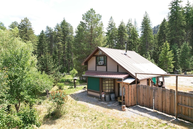 64 Ponderosa Ln, Thompson Falls, MT 59873 - back of property with a metal roof and a view of trees