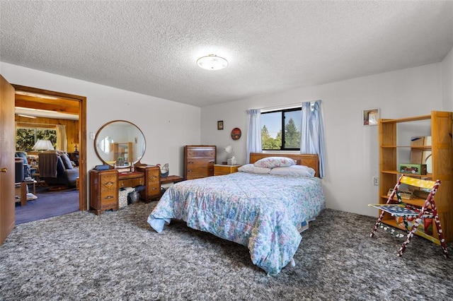 628 Kelley Rd, Columbia Falls, MT 59912 - carpeted bedroom with multiple windows and a textured ceiling