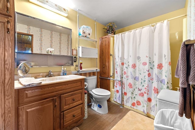 628 Kelley Rd, Columbia Falls, MT 59912 - full bathroom with wood finished floors, vanity, and a shower with shower curtain