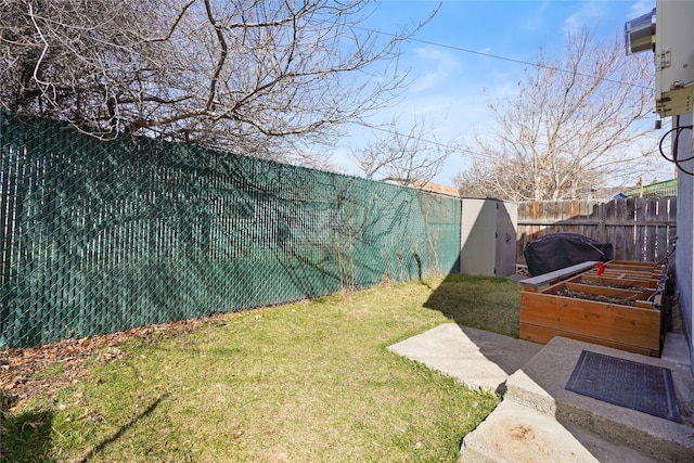view of yard with a garden and fence