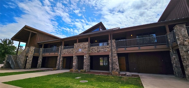 view of building exterior featuring concrete driveway and a garage