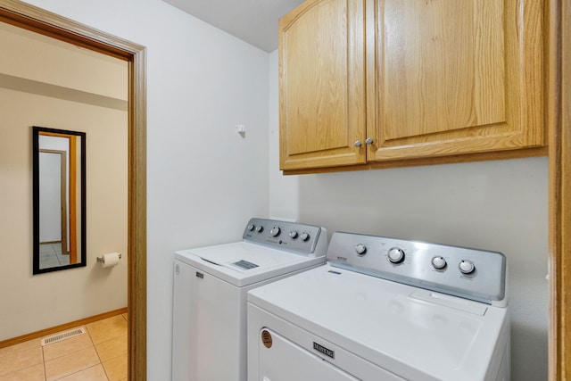 1923 Montana St Unit B, Missoula, MT 59801 - washroom featuring light tile patterned floors, independent washer and dryer, visible vents, baseboards, and cabinet space