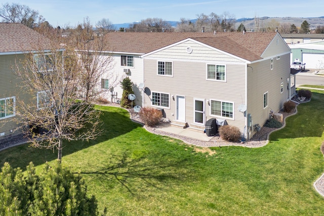 1923 Montana St Unit B, Missoula, MT 59801 - rear view of property with a yard, entry steps, and a shingled roof