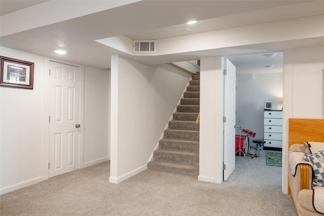 1634 W Central Ave, Missoula, MT 59801 - finished basement featuring light colored carpet, baseboards, stairway, and recessed lighting